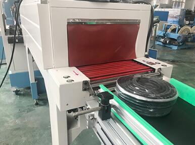 Automatic coiling and thermoplastic packing line